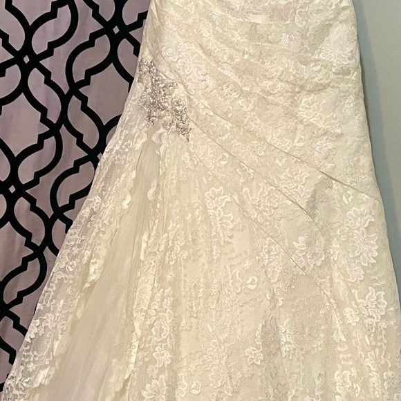 David's Bridal Lace Strapless Wedding Gown in the color “Ivory”. - Picture 14 of 16